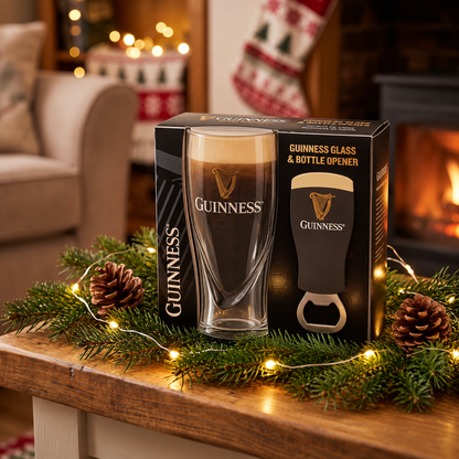 The Guinness Embossed Glass & Opener Set from Guinness Webstore US sits on a wooden table, ideal for home bars or as a festive stocking stuffer.