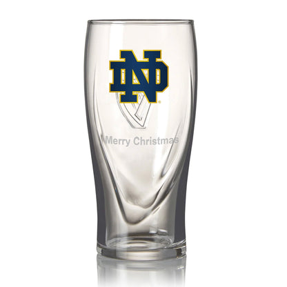 The Guinness Notre Dame 16oz Pint Glass, featuring a navy "ND" logo with "Merry Christmas" engraved below, is an exceptional piece of Notre Dame merchandise.