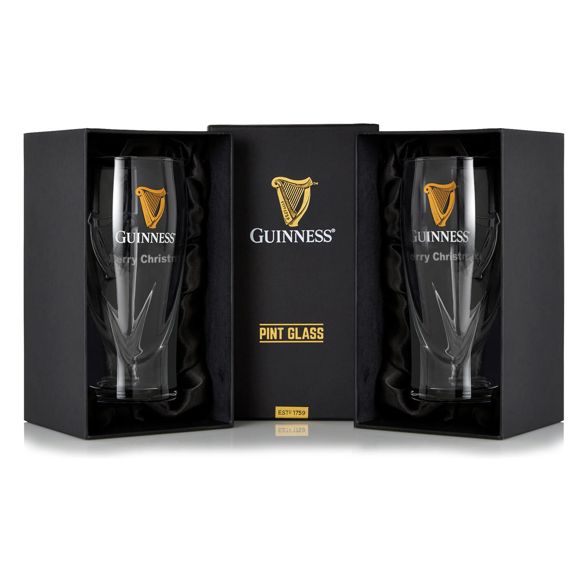 The Guinness Pint Glass Twin Pack includes two glasses in black gift boxes, adorned with a gold harp logo and "Merry Christmas" text—perfect for any beer glass collection.