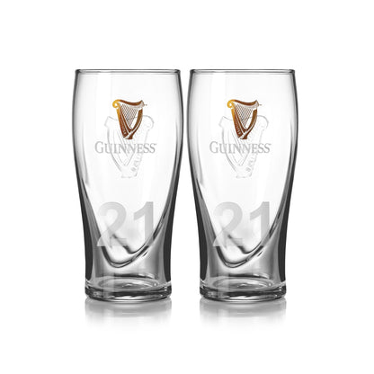 The Guinness Pint Glass Twin Pack offers two clear glasses featuring the brand's iconic logo and the number 21, making them ideal for any beer glass collection. Perfect for a classic pint, they seamlessly blend traditional design with timeless appeal.