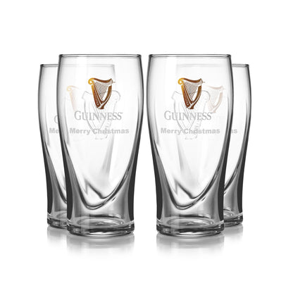 A four-pack of Guinness pint glasses featuring the iconic harp logo and festive "Merry Christmas" text.