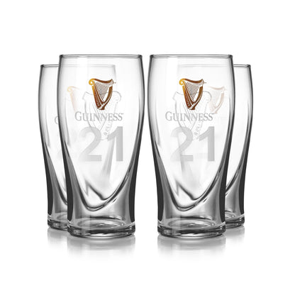 The Guinness Pint Glass 4 Pack includes four embossed pint glasses with the iconic Guinness logo and number 21, ideal for home bar accessories.