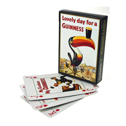Guinness Vintage Toucan Playing Cards – 54-Card Deck featuring a deck and its box, showcasing a vintage toucan balancing a glass of stout on its beak with the text “Lovely day for a GUINNESS.”