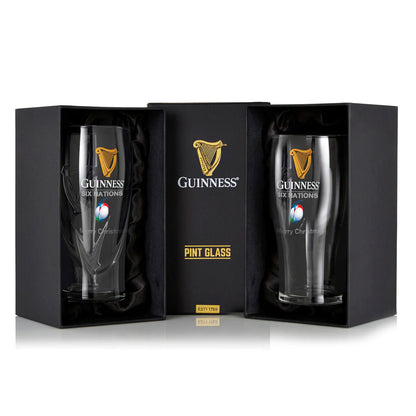 The Guinness Six Nations Pint Glass - 2 Pack from Guinness Webstore US features two pint glasses in black gift boxes with the iconic logo, ideal for enhancing your rugby viewing experience.