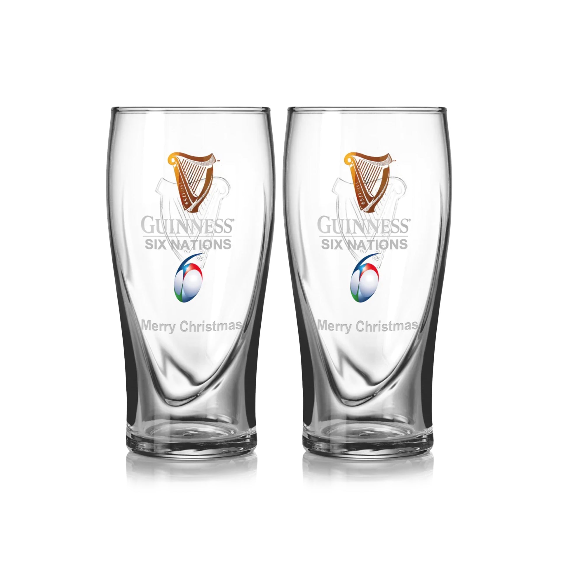 The Guinness Six Nations Pint Glass - 2 Pack from Guinness Webstore US features two clear pint glasses with the "Guinness Six Nations" logo, a rugby ball graphic, and "Merry Christmas" etched—ideal for rugby fans this holiday season.