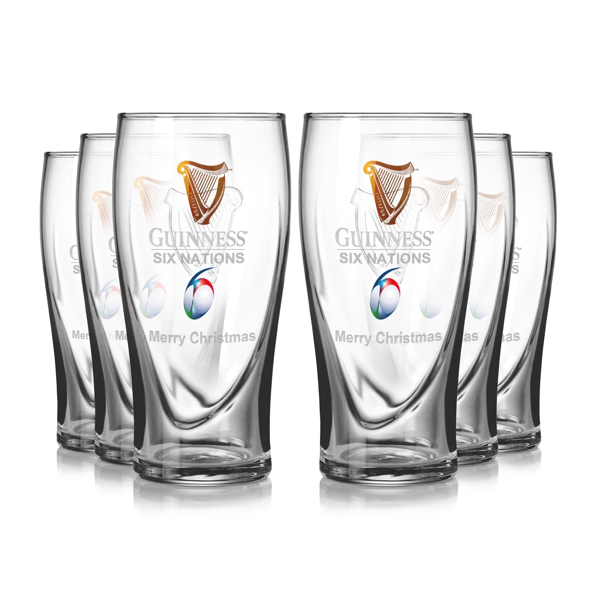 The Guinness Six Nations Pint Glass - 6 Pack from Guinness Webstore US features six pint glasses with “Merry Christmas” and a rugby logo on the front, arranged in two rows against a white background.