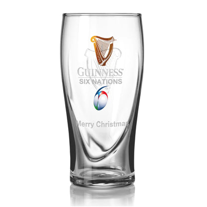 The Guinness Six Nations Pint Glass from Guinness Webstore US features the classic Harp, Six Nations rugby symbol, and "Merry Christmas"—a perfect festive gift for any rugby fan.