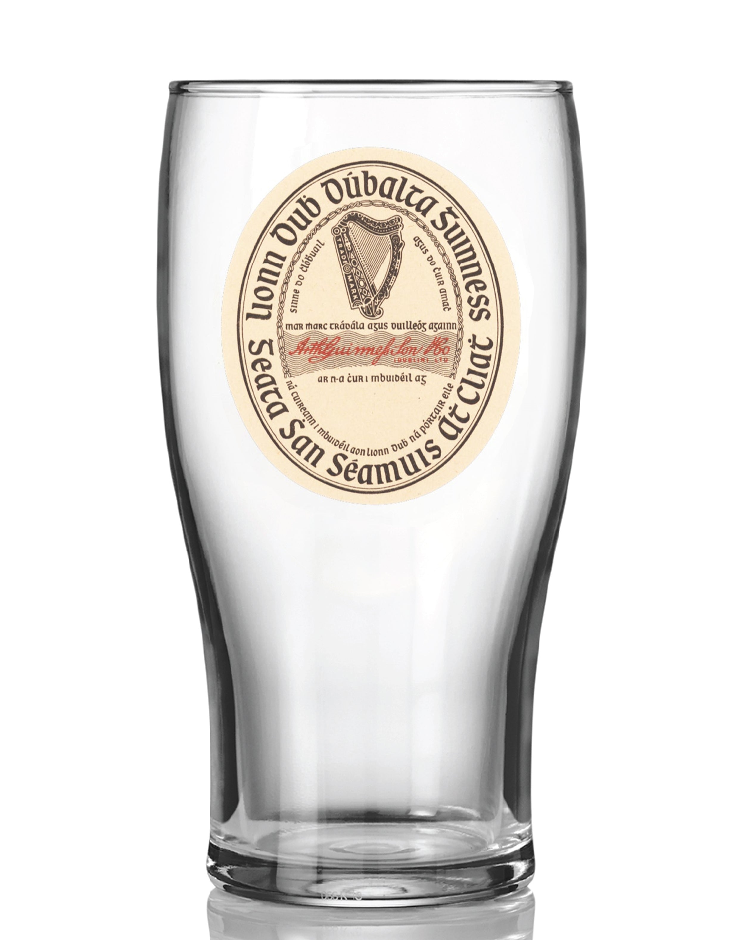 The Guinness Vintage Label Pint Glass from Guinness Webstore US is a clear tulip pint glass displaying a round, vintage-style Guinness Extra Stout label with the iconic harp logo and bilingual English-Irish text.