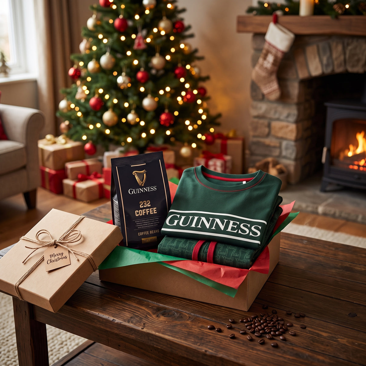 A Guinness Christmas Morning Gift Set containing a bag of coffee beans and a folded green sweater in a box on a wooden table, with a Christmas tree and fireplace in the background.