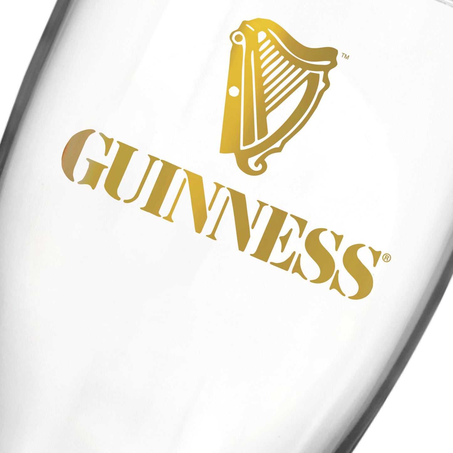 Introducing the Guinness Vintage Gold Harp Pint Glass from Guinness Webstore US—this clear pint glass showcases the iconic gold Guinness logo and classic harp emblem printed on its side, making it a must-have vintage barware piece inspired by timeless retro designs.