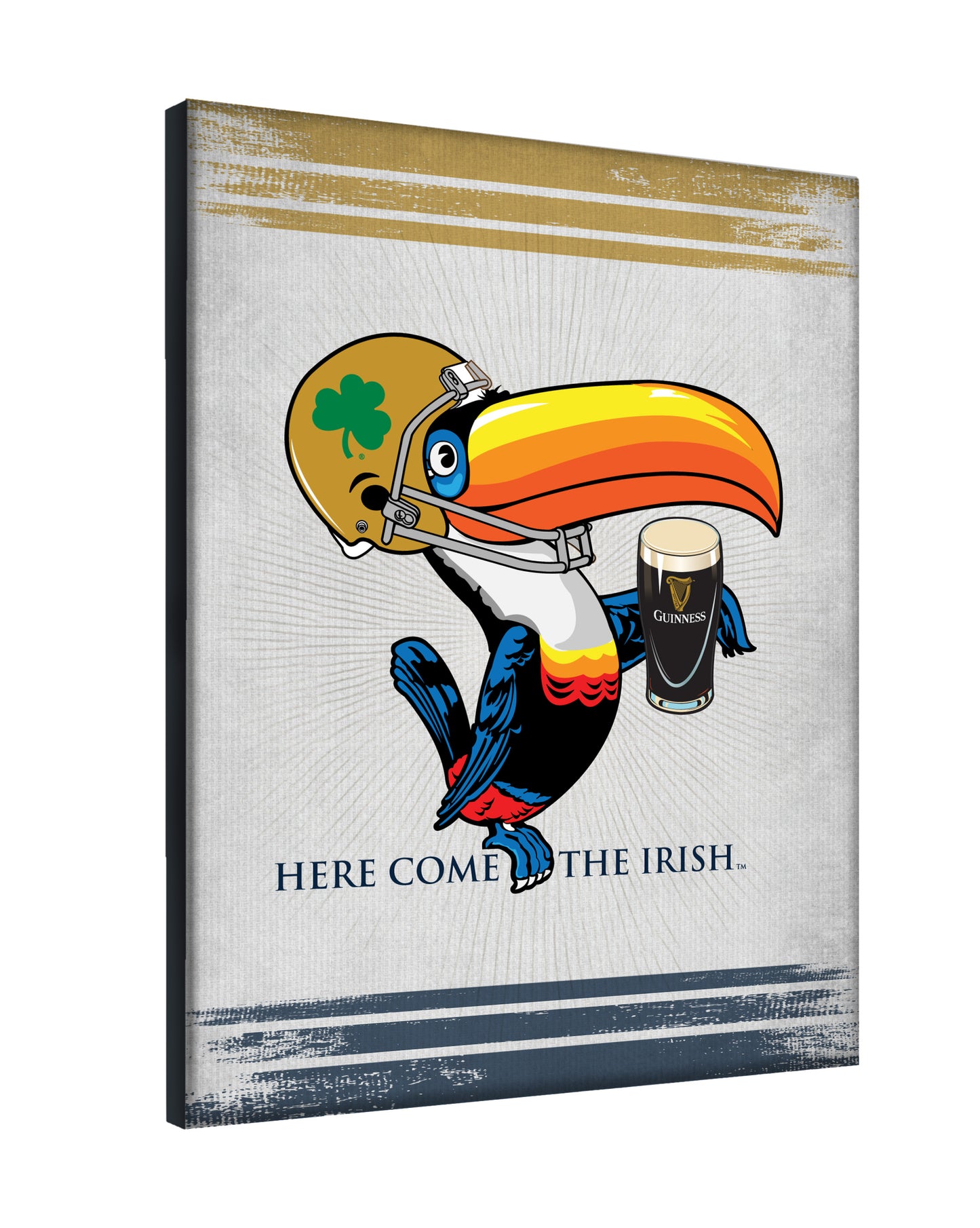 The Guinness Notre Dame Toucan Canvas Wall Art features a cartoon toucan in a gold football helmet with a shamrock, holding a pint of Guinness above "Here Come the Irish"—a playful piece for fans by Guinness.