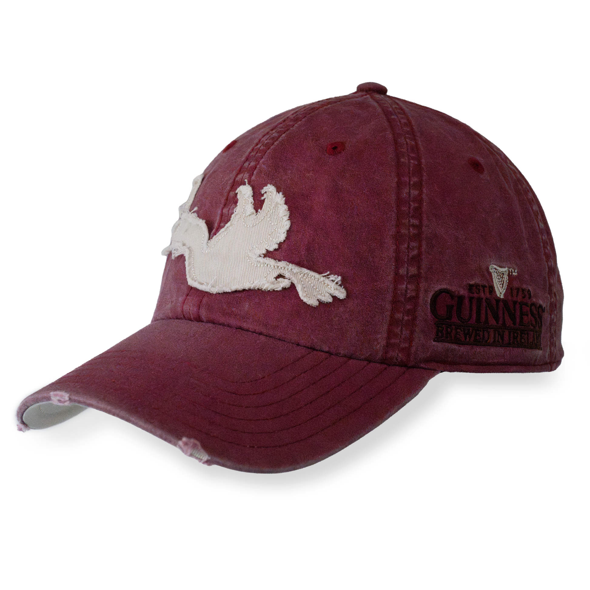 The Guinness Red Toucan Cap from Guinness Webstore US features a white embroidered toucan on the front, "Guinness Brewing" text on the side, visible stitching, and a gently worn brim—a tribute to the iconic Irish stout.