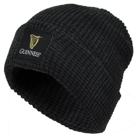 The Guinness Thermal Warm Beanie is a black knit hat with a rectangular patch featuring the Guinness logo and harp on the front. This cozy, unisex beanie keeps you warm and is perfect for any fan of the iconic Guinness brand.