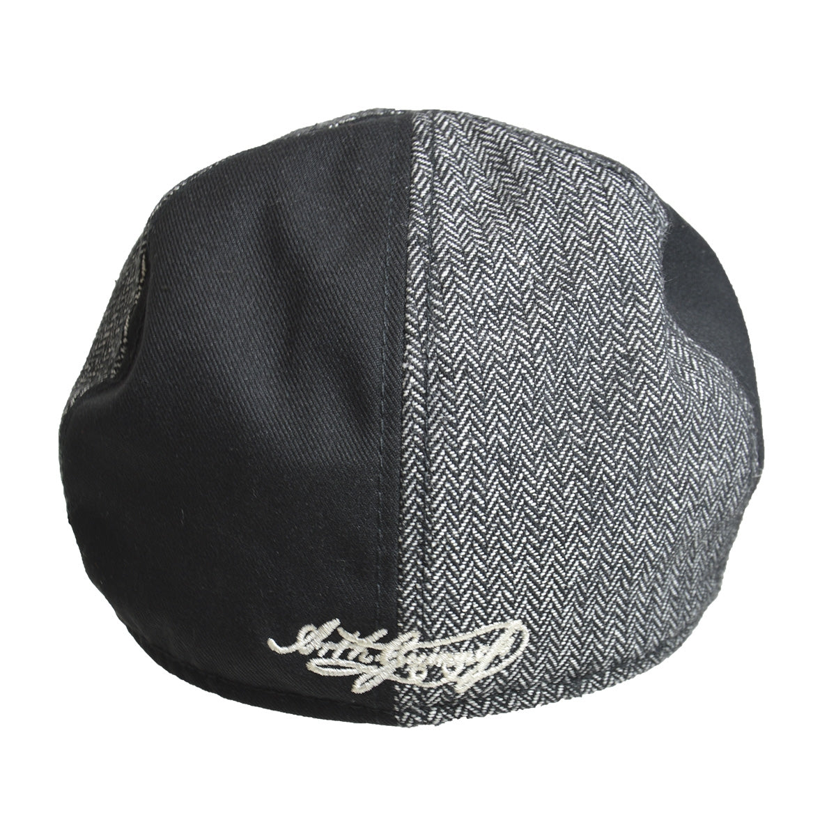 A Guinness Paneled Ivy Cap embroidered with the word herringbone.