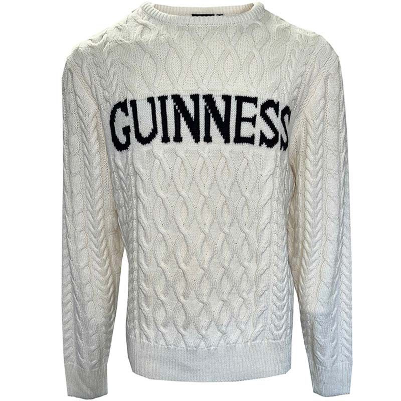 The Guinness Cream Cable Knit Jumper from Guinness Webstore US showcases classic Irish Aran patterns and "GUINNESS" in bold black across the chest—a stylish winter essential.