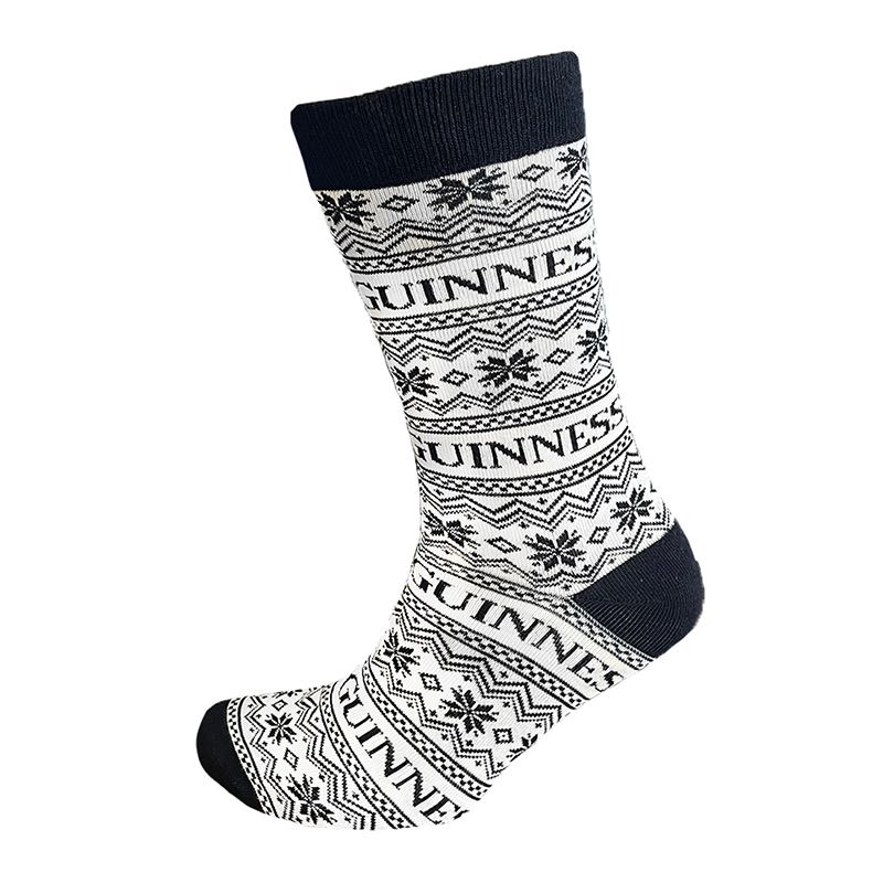 The cream and black Guinness Festive Socks, featuring the word "Guinness" along with snowflake patterns, add a perfect touch of holiday cheer.