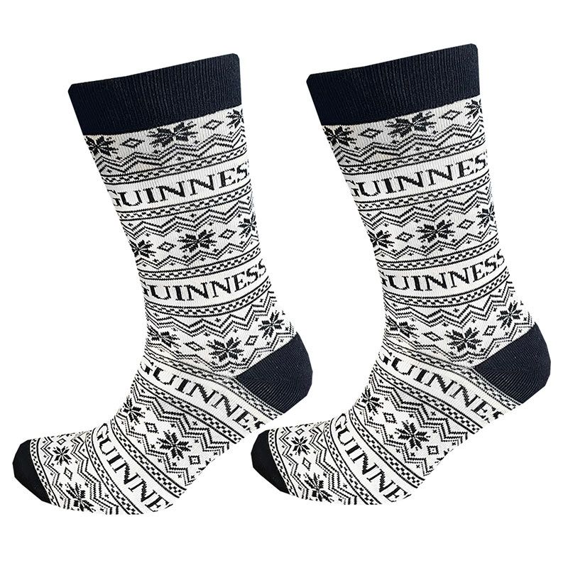 These cream socks, featuring black decorative patterns and the word "GUINNESS" throughout, add a festive flair to your wardrobe. Perfect for infusing some holiday spirit, they're a stylish nod to the Guinness Festive Socks by Guinness.