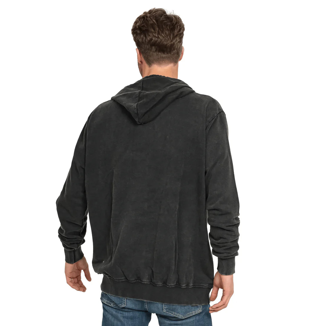 A man with short hair is seen from the back, wearing a dark-colored hoodie labeled as the Guinness Premium Harp Hoodie from Guinness Webstore US, along with jeans.