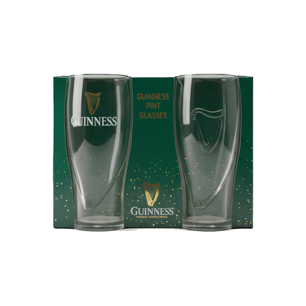 The Guinness Gravity Pint Glass 2 Pack Gift Set features two clear pint glasses in front of stylish green packaging with gold accents—the must-have official merchandise for fans who love an iconic Guinness pour.