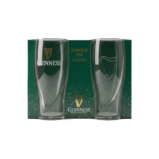The Guinness Gravity Pint Glass 2 Pack Gift Set features two clear pint glasses in front of stylish green packaging with gold accents—the must-have official merchandise for fans who love an iconic Guinness pour.