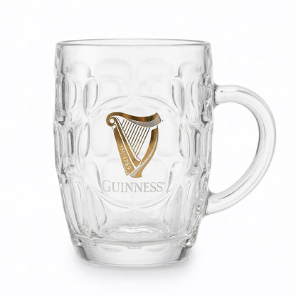 The Guinness Webstore US 20 oz Guinness Gold Harp Dimple Glass Mug features the iconic gold harp logo and handle—an ideal tankard for any Irish pub mug collection.