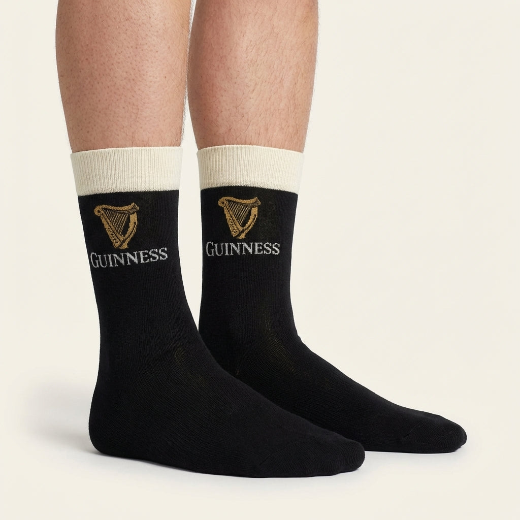 Show off your style with Guinness Pint Crew Socks – Black, featuring a gold harp and “Guinness”—a unique gift for any Guinness fan.