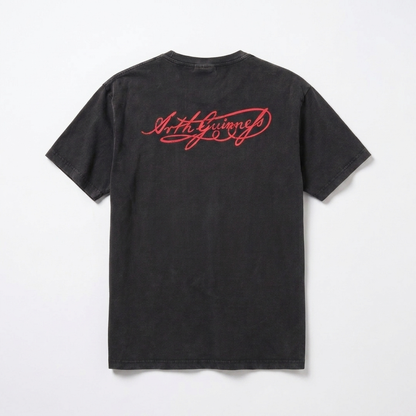 Guinness Black Distressed Label Tee by Guinness displayed flat on a plain white background, featuring red cursive text on the upper back. This unisex graphic tee combines timeless style with everyday comfort.