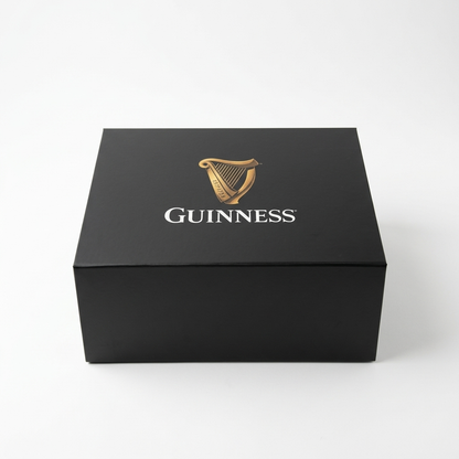A square black Guinness Gift Box - Large featuring a gold harp logo and white text on the lid.