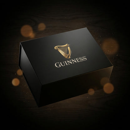 A black Guinness Gift Box - Large featuring a gold harp logo and the word “GUINNESS” printed on the lid.