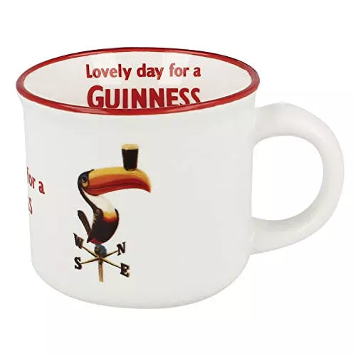 The Guinness Toucan White Espresso Cup from the Guinness Webstore US exudes Irish charm with its iconic design, featuring the famous Guinness Toucan expertly balancing a pint on its colorful beak. This white cup with a red rim perfectly frames the artwork and is adorned with the time-honored phrase: "Lovely day for a Guinness.