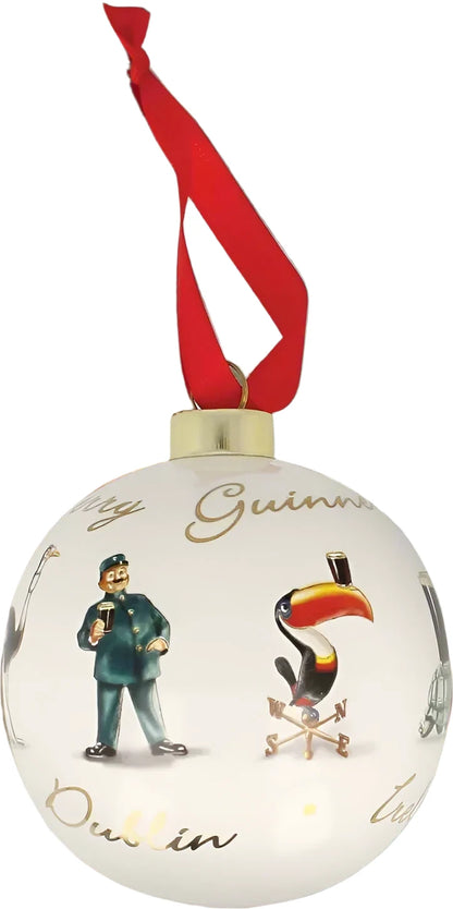 This Guinness Gilroy Ceramic Holiday Bauble embraces the festive spirit with its delightful illustrations of a man enjoying a pint and the iconic Guinness Toucan holding another. Adorned with a red ribbon, this white Christmas ornament is perfect for adding charm and cheer to your holiday decor.