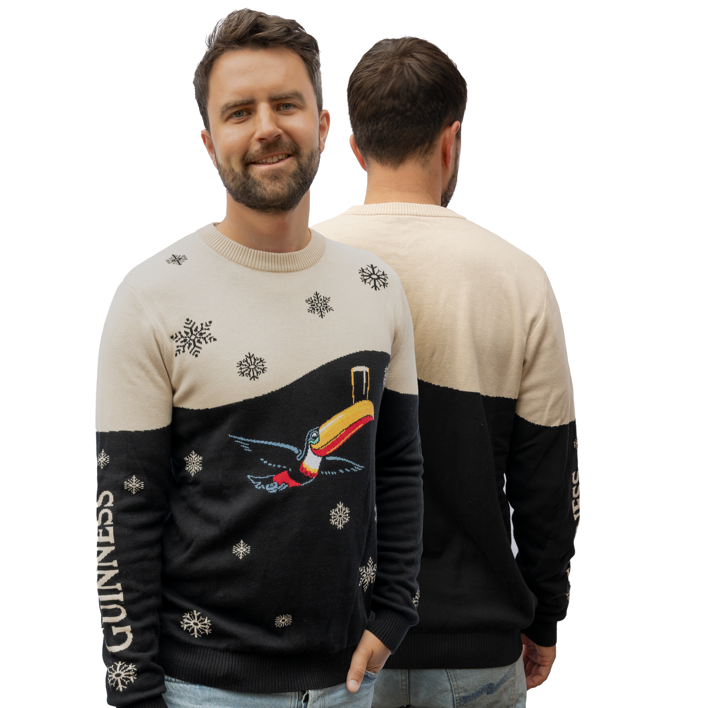 A man is wearing a Guinness Holiday Black and Cream Toucan Sweater, featuring snowflakes and the "Guinness" lettering on the sleeves for a festive style, with both front and back views displayed.