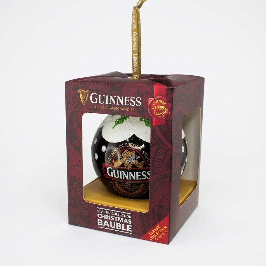 Add a festive touch to your holiday décor with the Guinness Classic Label Glass Bauble, presented in a red and gold display box with a clear window. Featuring the official Guinness logo and classic label design, this ornament from Guinness includes a hanging ribbon attached at the top. It’s the perfect beer lover’s gift or a unique way to display your love of Guinness on your Christmas tree.